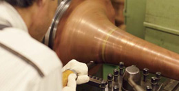 Craftsman making a tuba